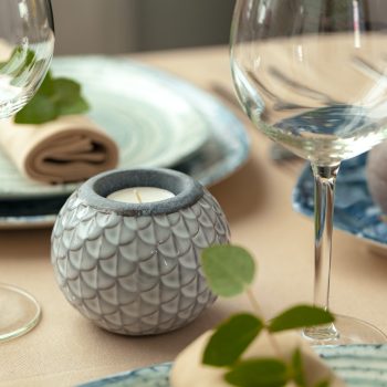 Table setting set with candles and plant branches